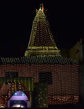 The mandir lit up at night